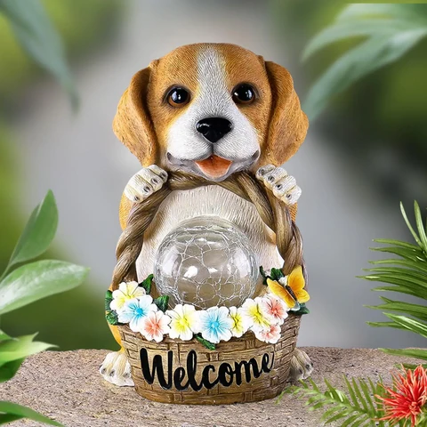 Resin dog figure lit by a solar LED, a weatherproof ornament for the garden