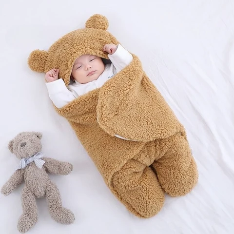 Baby in a thick fleece-lined hooded blanket