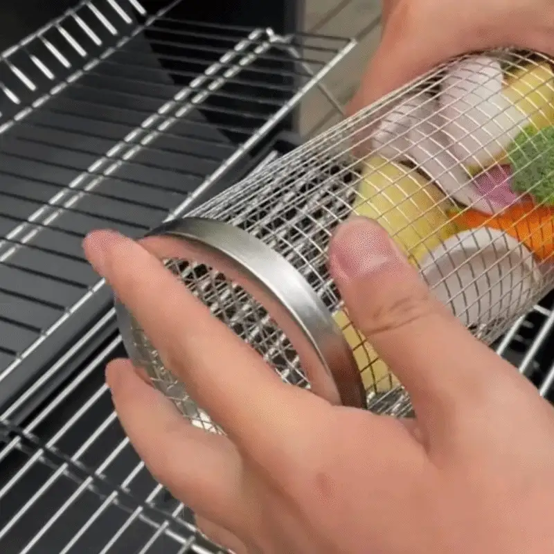 Rotating grill basket turning food evenly over the grill