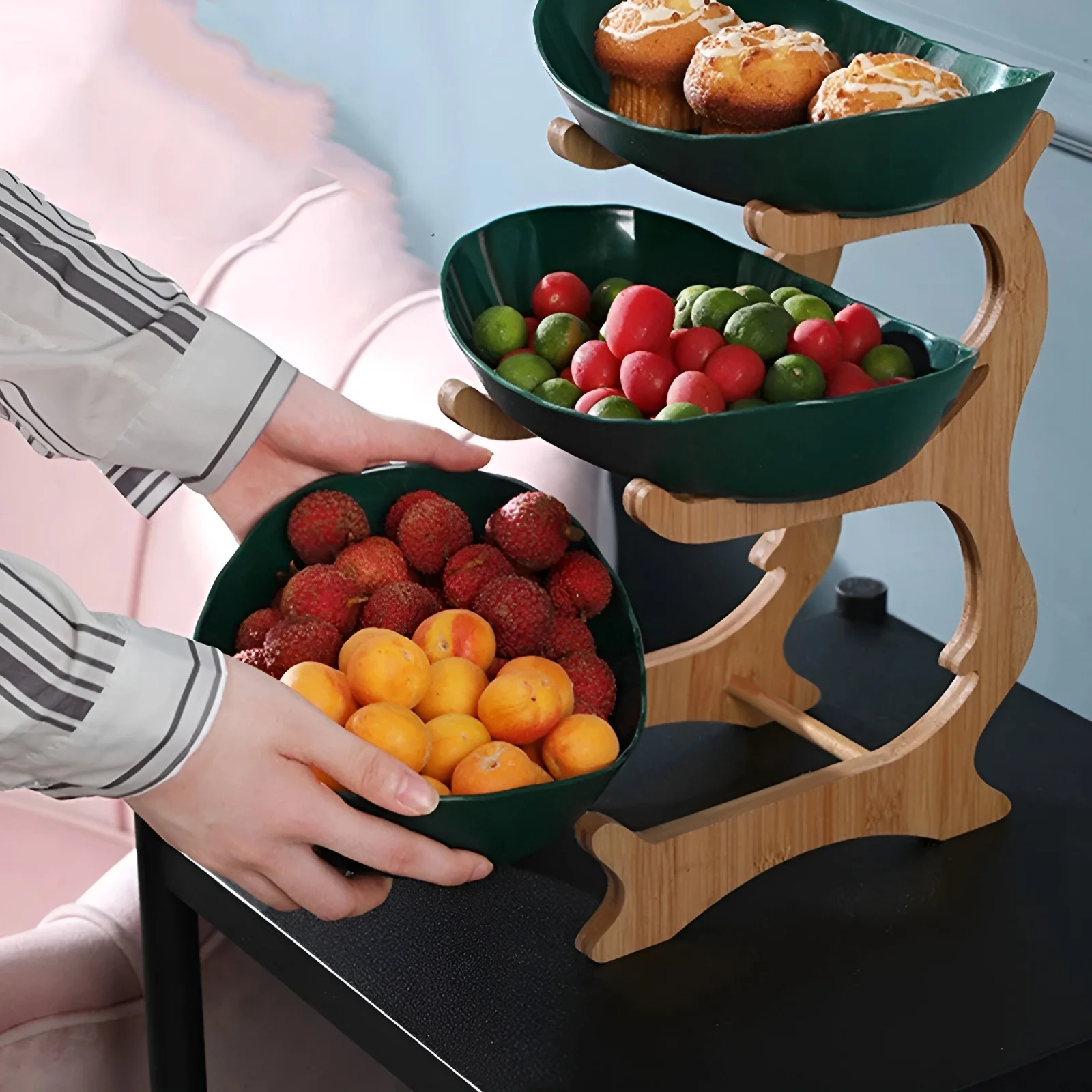 Wooden Tiered Fruit Bowl holding fruit and snacks in a kitchen