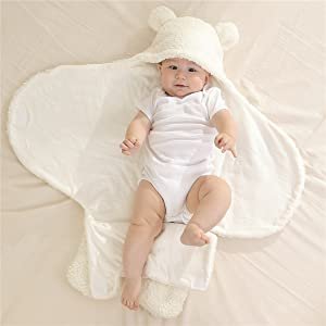 Baby being placed on the sleep pod