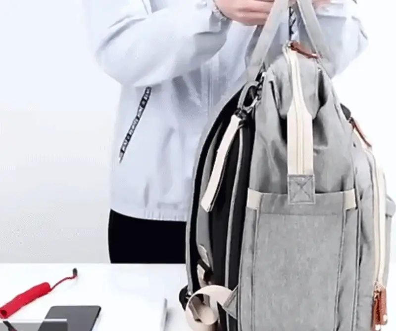 Diaper backpack that converts into a foldable baby bed